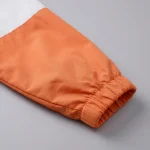 Áo khoác gió đồng phục cam phối trắng Thành Tín - ảnh cận tay áo