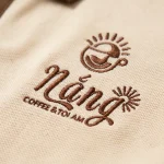 Áo Polo Đồng Phục Kem Phối Nâu - can logo thuong hieu