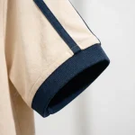 Áo Polo Đồng Phục Kem Phối Navy - can tay ao