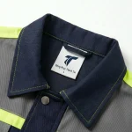 Đồng phục bảo hộ xanh navy phối phản quang vàng Thành Tín - ảnh cận cổ áo và logo