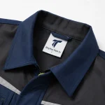 Đồng phục bảo hộ xanh navy phối phản quang vàng mẫu 2 Thành Tín - ảnh cận cổ áo và logo